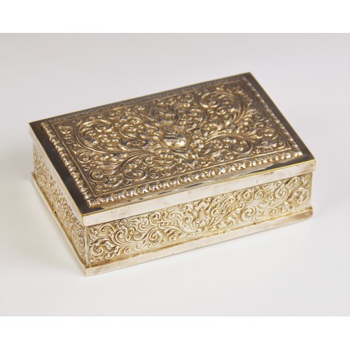 14 - An Eastern style silver plated jewellery casket, of rectangular form, elaborately embossed with scro... 
