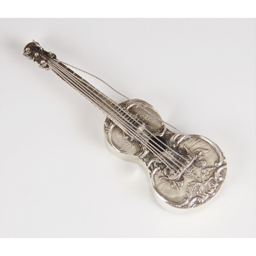18 - A Dutch silver miniature model of a guitar, of typical form, embossed with cherubs playing instrumen... 