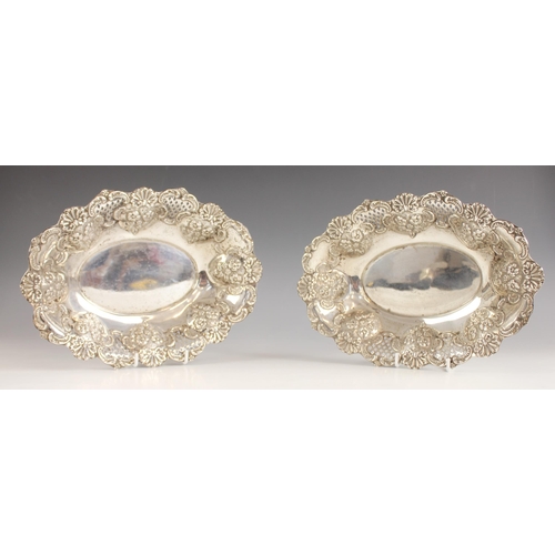 125 - A pair of Victorian silver oval dishes, William Devenport, Birmingham 1898, the dishes with embossed... 