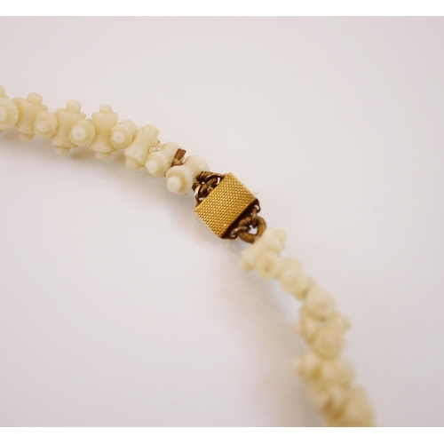 204 - A 'white coloured coral' necklace, designed as a series of cylindrical branches, with yellow metal e... 