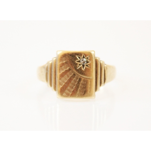 216 - A 9ct yellow gold signet ring, the rectangular shaped head with diamond chip set sun engraved detail... 