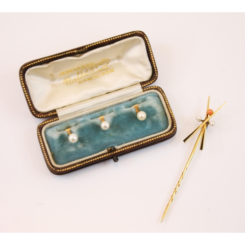 227 - A cased set of pearl set dress studs, the button shaped cultured pearls mounted upon a yellow metal ... 