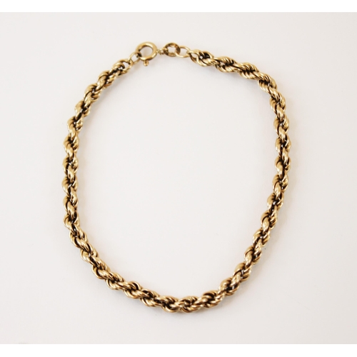 229 - A yellow metal bracelet, of rope twist design, with bolt ring clasp, stamped '3.975' marks rubbed, 1... 