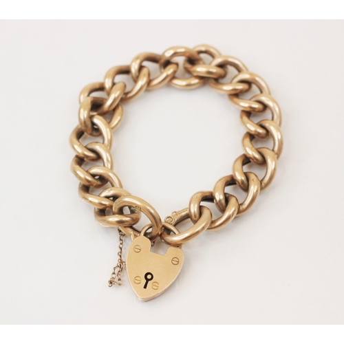 237 - A yellow metal hollow curb link bracelet, with padlock heart fastener, stamped 'WHW Ld' 9ct, the lin... 