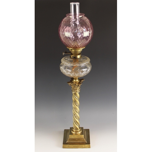 538 - An F S & Co Ltd oil lamp of large proportions, late 19th or early 20th century, the dimpled cranberr... 