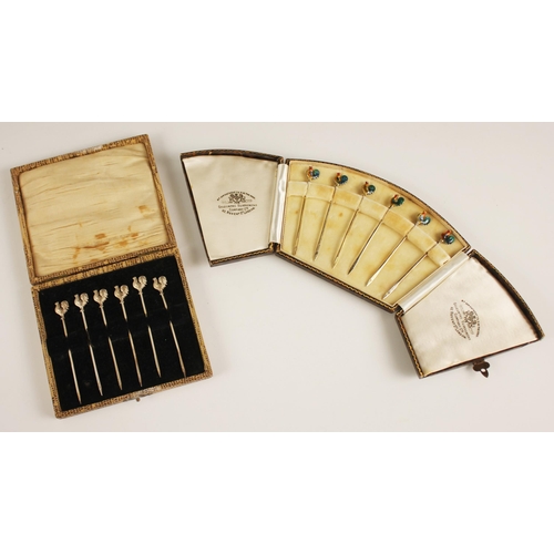 103 - A cased set of George V silver cocktail sticks, Adie Brothers Ltd, London 1933, the terminal modelle... 