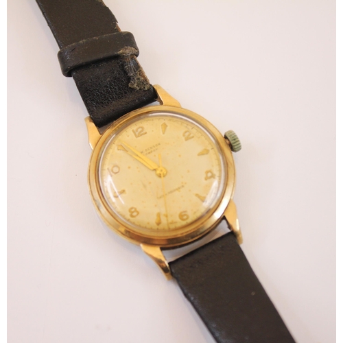 153 - A yellow metal cased JW Benson shock absorber gentleman's wristwatch, the circular champagne coloure... 