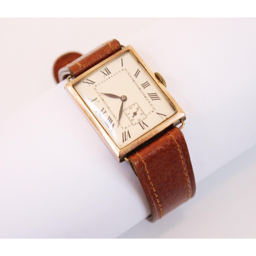 154 - A mid 20th century 9ct gold wristwatch, the silvered rectangular dial with Roman numerals and subsid... 