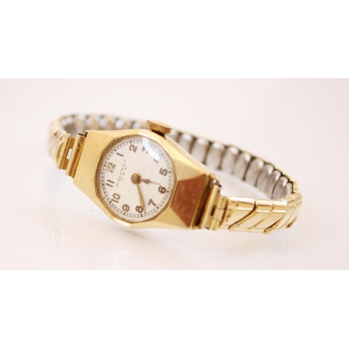 159 - An Art Deco 9ct gold cased tonneau shaped Waltham wristwatch, the circular cream dial with Arabic nu... 