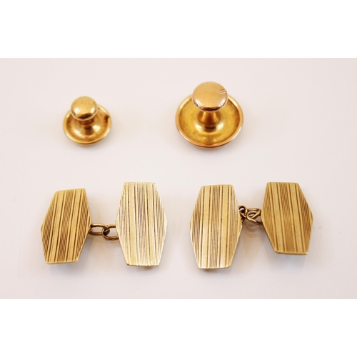 189 - A pair of yellow metal cufflinks, each link of flattened hexagonal form with engine turned decoratio... 