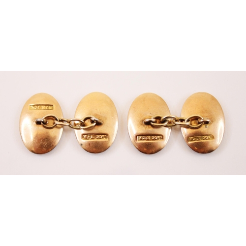 190 - A pair of yellow metal cufflinks, each link of oval concave plain polished form, 17mm long, with tra... 