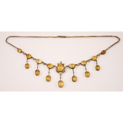 194 - A mid-20th century citrine and seed pearl fringe necklace, designed as nine graduated oval cut citri... 