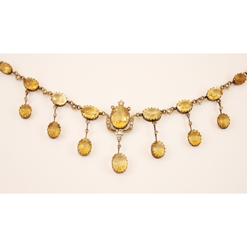 194 - A mid-20th century citrine and seed pearl fringe necklace, designed as nine graduated oval cut citri... 