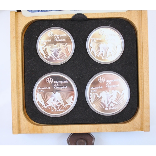 275 - A sterling silver cased 'Olympic coin proof set' minted by The Royal Canadian Mint, the coins depict... 