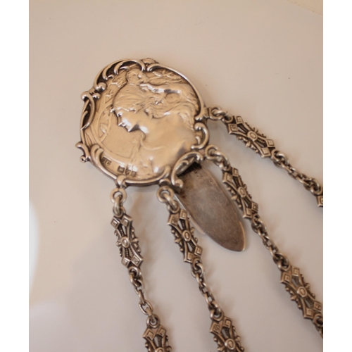 35 - An Edwardian silver chatelaine, Colen Hewer Cheshire, Chester 1903, the circular clip depicting Art ... 