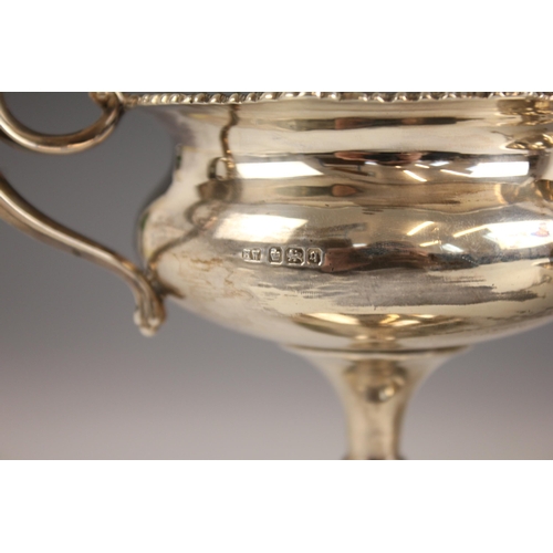 73 - An Edwardian silver sugar bowl, Wakely and Wheeler, London 1910, the ogee rim above a plain polished... 