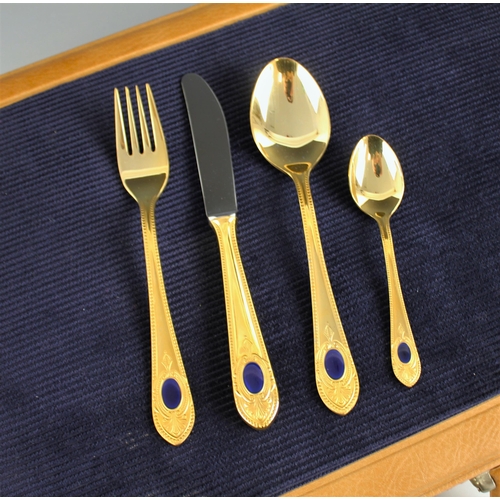 141 - A Royal Collection 'Solingen' canteen of cutlery, the twelve place gold plated setting setting with ... 