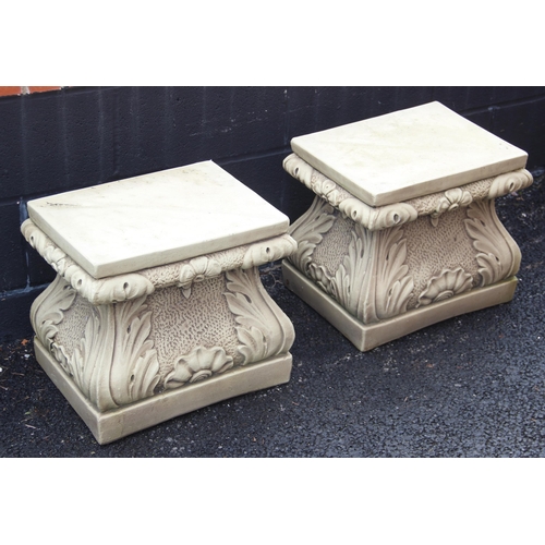 711 - A pair of reconstituted stone plinths, of ogee form, moulded in relief with shell and acanthus detai... 