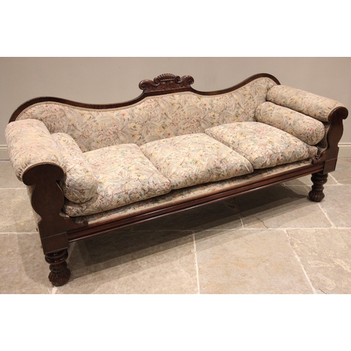 810 - A William IV carved mahogany framed sofa, the shaped back centred with a 'C' scroll crest extending ... 