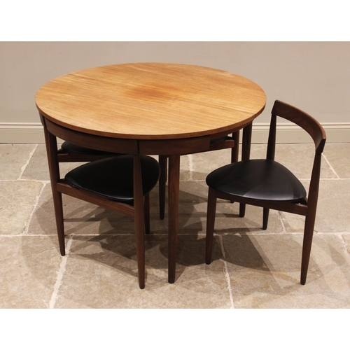 839 - Frem Rojle Denmark, a teak 'Roundette' dining table with six integral chairs, mid 20th century, each... 