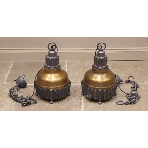 539 - A pair of cast metal industrial type ceiling lights, of bell form with a painted domed shade, enclos... 