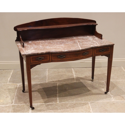 825 - An Edwardian mahogany marble top washstand by Maple & Co, of rounded breakfront form, the rear galle... 