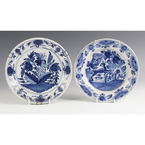 476 - A Delft tin glazed earthenware blue and white plate, 19th century, the well painted with a stag leap... 