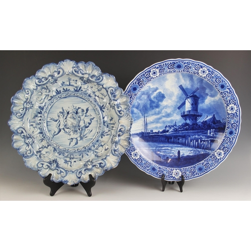 478 - A Cantagalli blue and white faience charger, 19th century, the relief moulded shell and scroll rim e... 