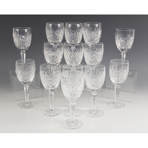 530 - Fourteen cut glass wine glasses, each on faceted stem and star cut base, each 16.5cm high (14)