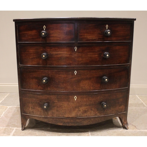 765 - An early 19th century mahogany bowfront chest of drawers, with an arrangement of two short over thre... 