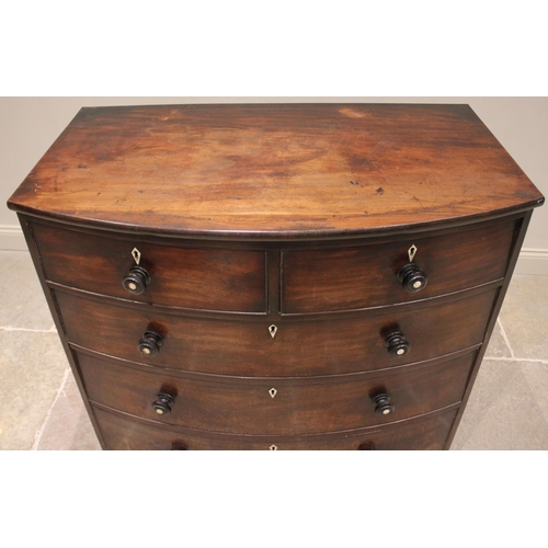 765 - An early 19th century mahogany bowfront chest of drawers, with an arrangement of two short over thre... 