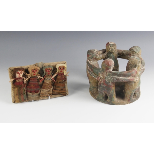 406 - An Art Pottery figural group, 20th century, modelled as five interlinked figures standing around a f... 