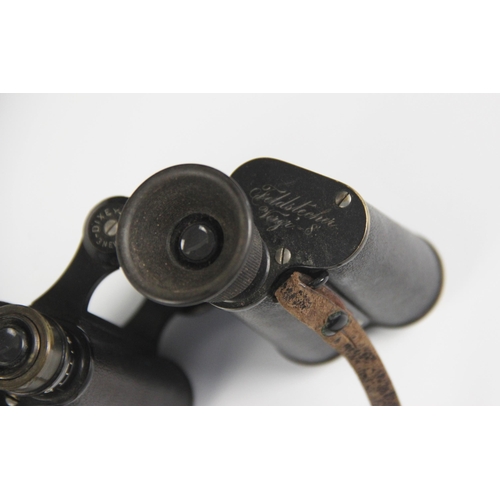 582 - A cased pair of Carl Zeiss Jena DRP Feldstecher Vergr 8 binoculars, early 20th century, retailed by ... 