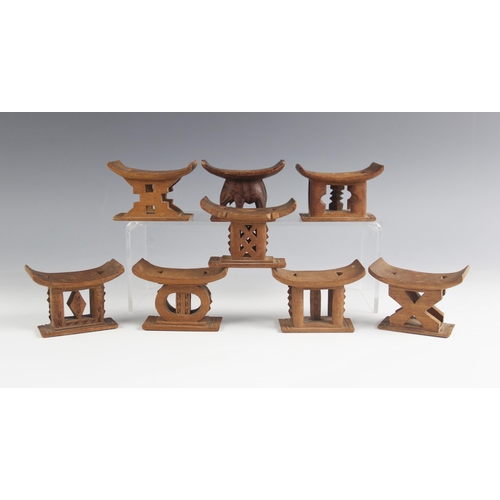 415 - Eight miniature West African Ghana Ashanti model tribal stools, each 6cm high (8)