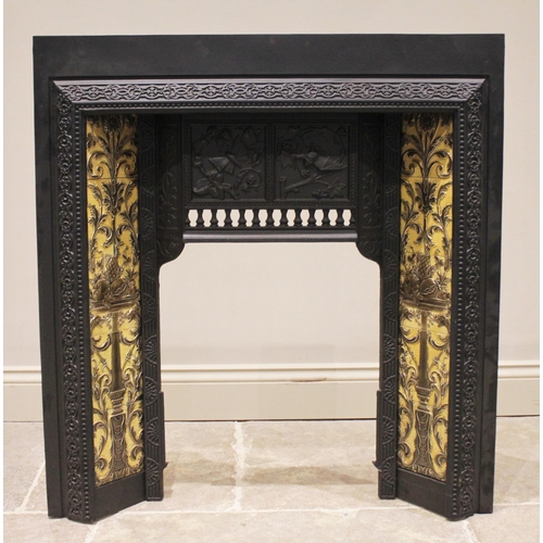 590 - A cast iron tile back fire surround, early 20th century, impressed 'The Salisbury, No.145' to the re... 