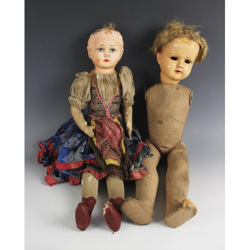 605 - A collection of antique dolls and doll parts, comprising: a papier-mache shoulder head doll, 19th ce... 