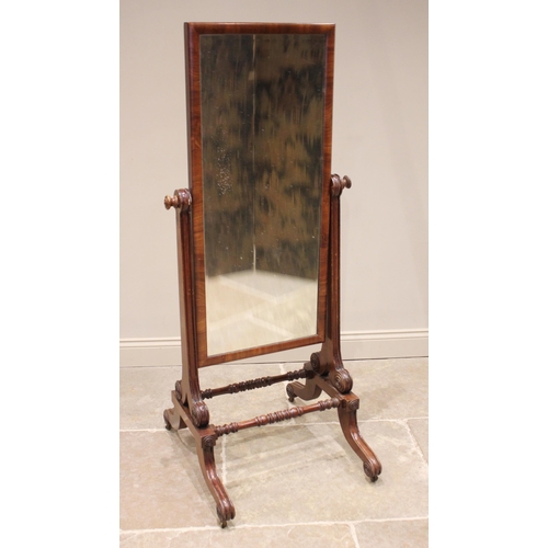 764 - A Regency mahogany cheval mirror, the rectangular mirrored plate within a plain moulded frame, upon ... 