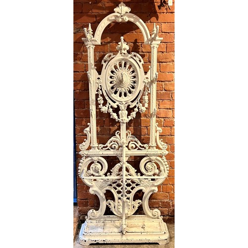 578 - A Victorian Coalbrookdale style cast iron hall stand, of arched form, with eight scrolled hooks, the... 