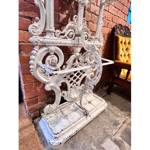 578 - A Victorian Coalbrookdale style cast iron hall stand, of arched form, with eight scrolled hooks, the... 