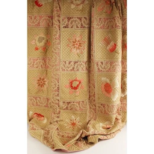 609 - An early 20th century quilt, comprised of twenty four florally embroidered panels in pink and red to... 