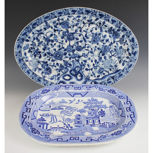 489 - A collection of blue and white meat plates, 19th century and later, comprising; a Willow pattern ova... 