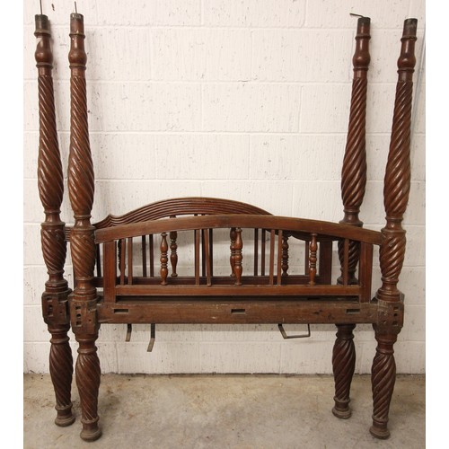 807 - A 19th century mahogany part tester bed, comprising head and foot board, each with an arched spindle... 