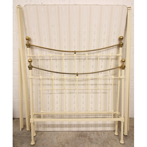 811 - A Victorian style painted iron and brass double bedstead, probably Seventh Heaven, with polished bra... 