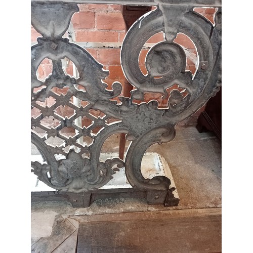 578 - A Victorian Coalbrookdale style cast iron hall stand, of arched form, with eight scrolled hooks, the... 