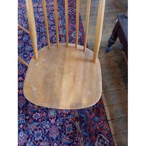 828 - A set of eight Ercol blonde elm and beech 'Goldsmith' dining chairs, mid 20th century, each with a c... 