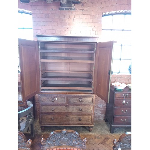 809 - A William IV mahogany linen press, the moulded cornice over an arched frieze extending to wrythen an... 