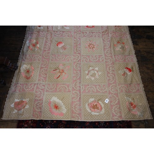 609 - An early 20th century quilt, comprised of twenty four florally embroidered panels in pink and red to... 