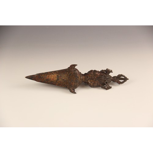 430 - A South East Asian Tantric Phurba (ritual dagger), decorated with mythical masks and beasts, lacquer... 