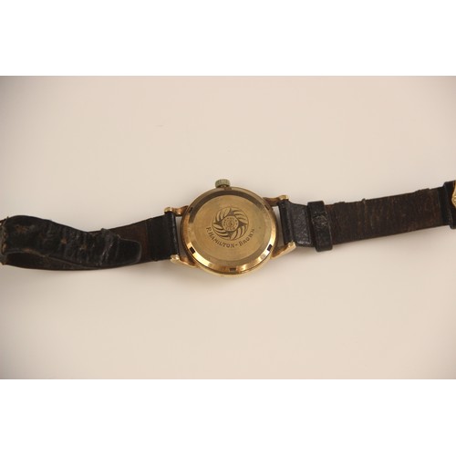 153 - A yellow metal cased JW Benson shock absorber gentleman's wristwatch, the circular champagne coloure... 