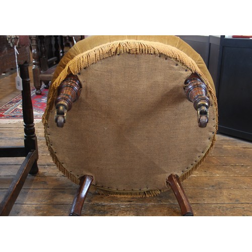 798 - A Victorian walnut and upholstered low seat chair, in gold velour fabric, the button back and circul... 